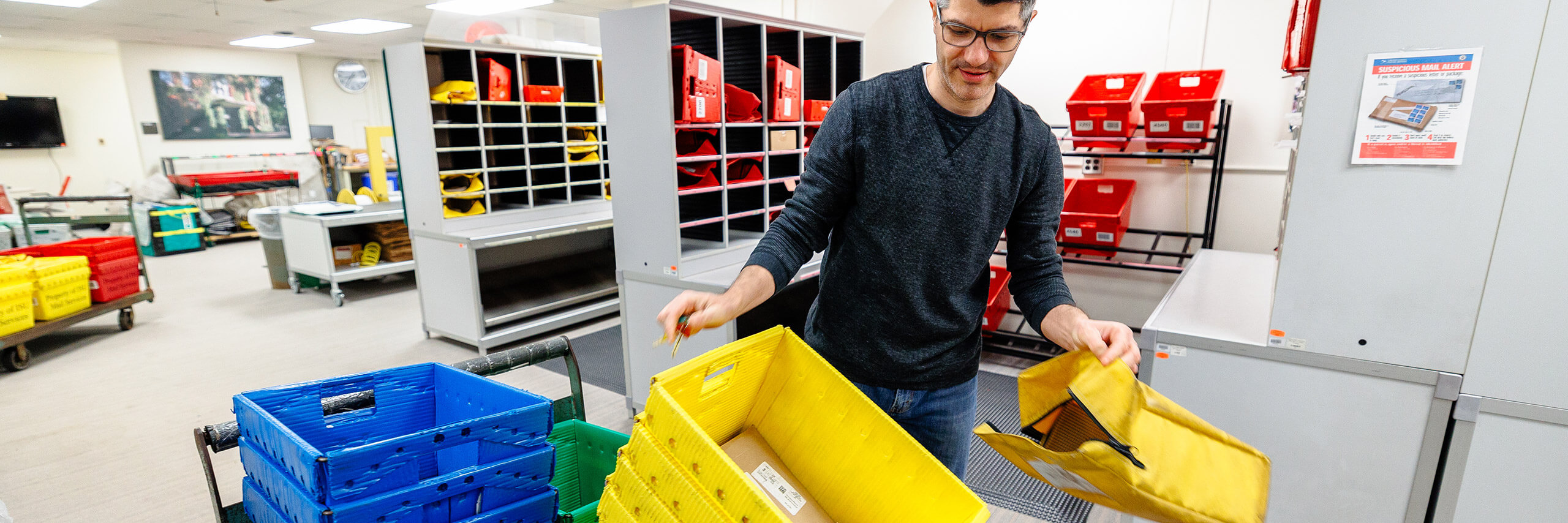 Employees are sorting and separating mail at the mail services