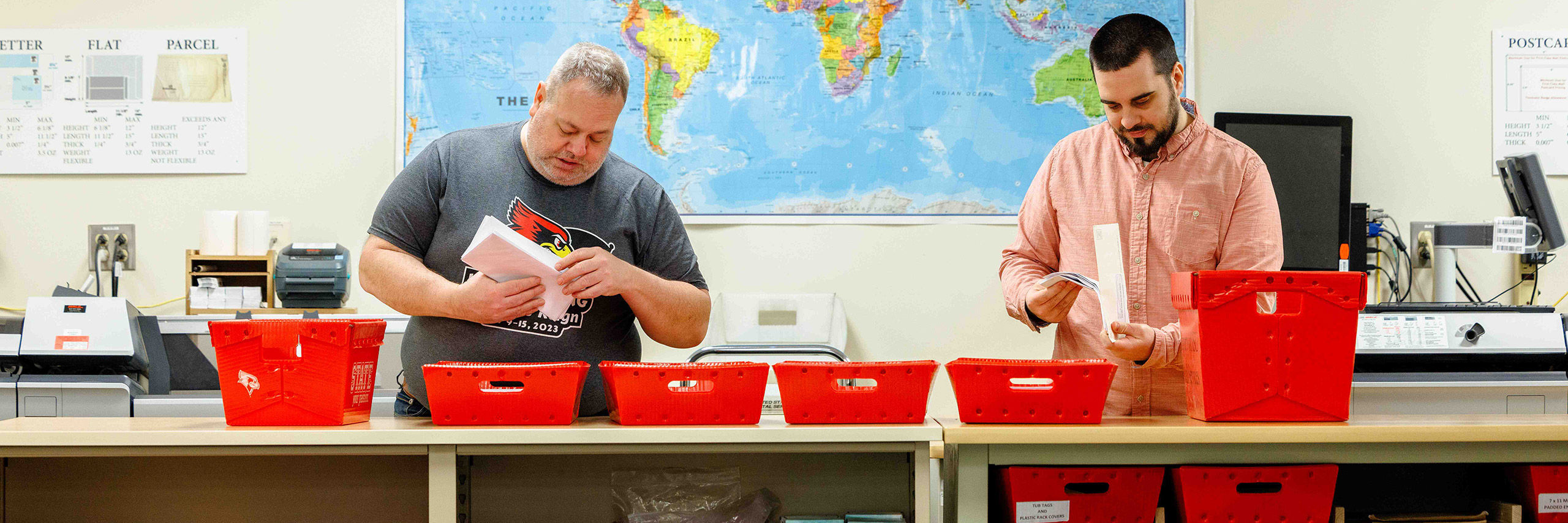 Mail Service employees working on sorting mail at the mail service office.